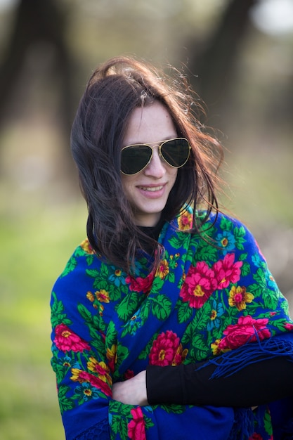 Young lady in black jacket and black sunglasses