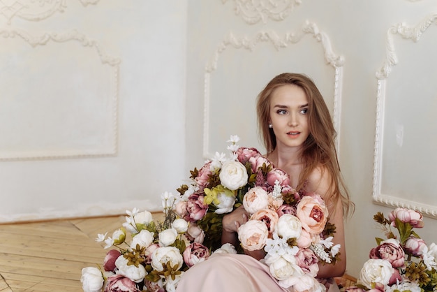 Young lady Caucasian white woman with blonde high-heeled hairstyle and bare shoulders posing with different colors