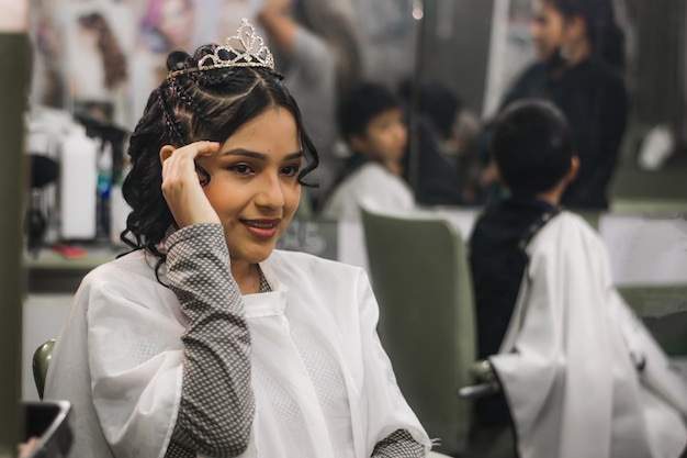 Young lady getting makeup and hair done in a professional spa or hair salon.