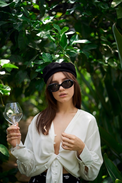 Young lady holding a wine glass