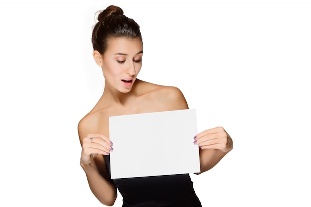 Young lady looking at blank sheet of paper