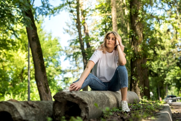 Young lady walks in the woods and have a great time outdoors. summer