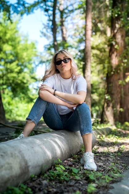 Young lady walks in the woods and have a great time outdoors. summer