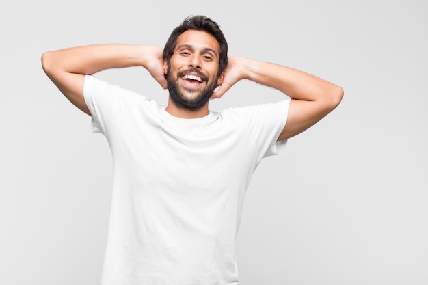 Young latin handsome man in t-shirt isolated