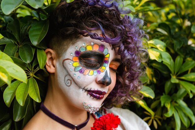 Young latin woman with La Calavera Catrina makeup