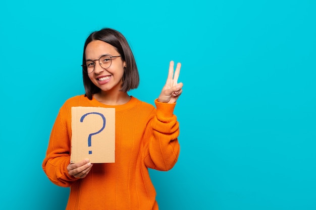 Young latin woman with question mark