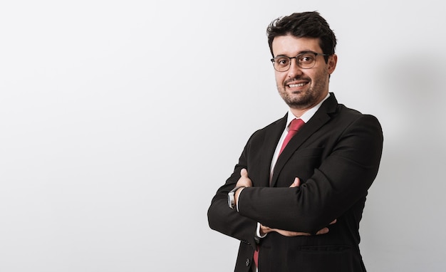 Young Latino businessman or lawyer on white background. Copy space.