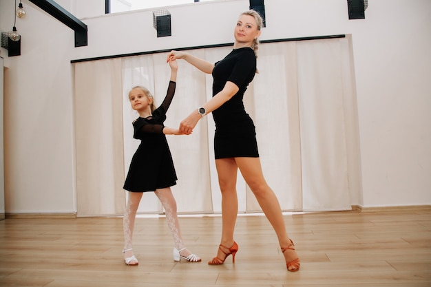 Young learners dancing with their choreography coach in the studio Activity concept