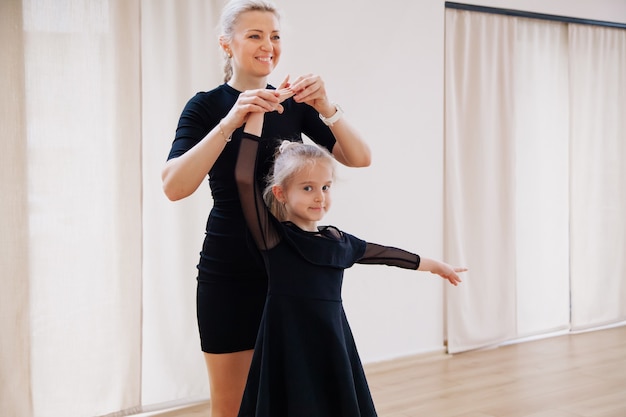 Young learners dancing with their choreography coach in the studio Activity concept