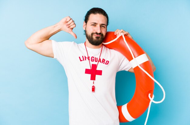 Young lifeguard man holding a rescue float isolated feels proud and self confident, example to follow