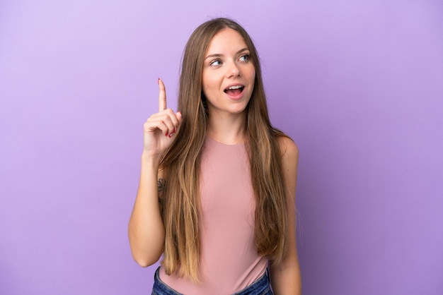 Young Lithuanian woman isolated on purple background intending to realizes the solution while lifting a finger up