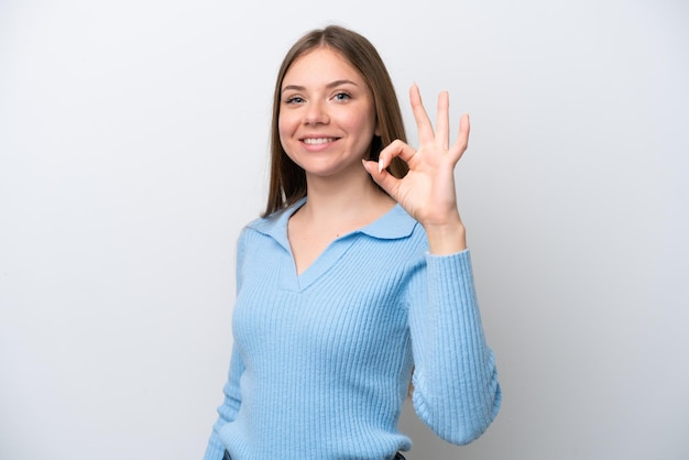 Young Lithuanian woman isolated on white background showing ok sign with fingers