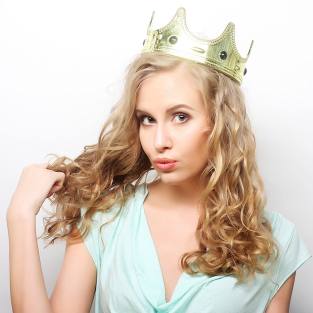 Young lovely expression woman in crown