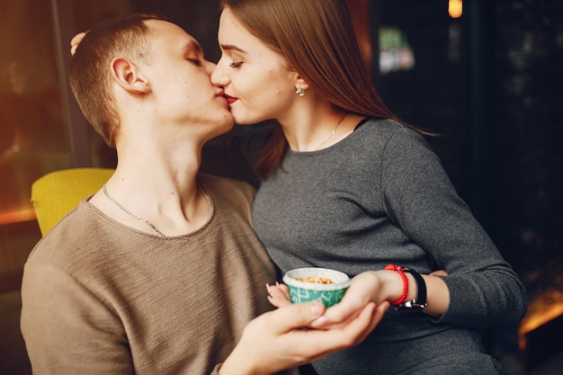 Young and loving couple sitting in a cafe