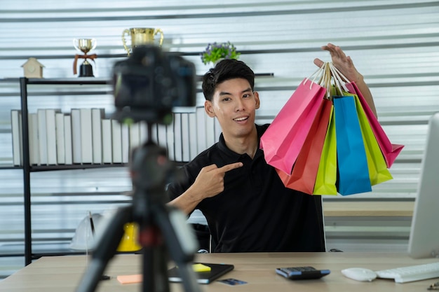 young male asian blogger present and review product on social media