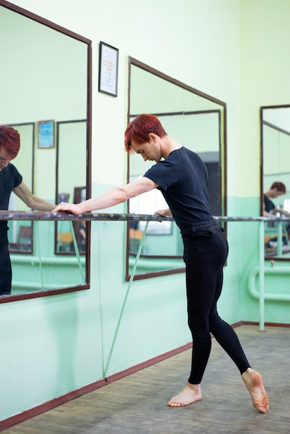 Young male dancer practicing new moves in dancing studio