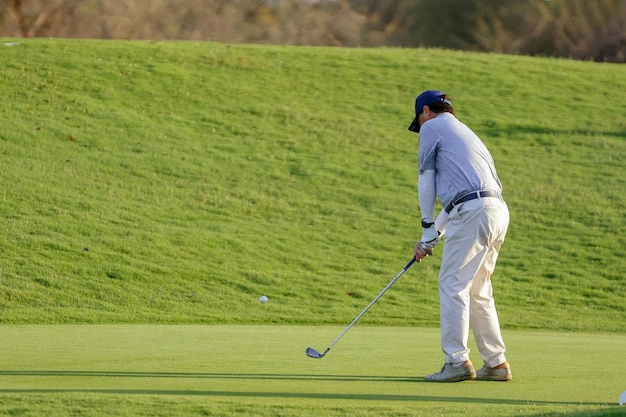 Young male golfer player on golf course