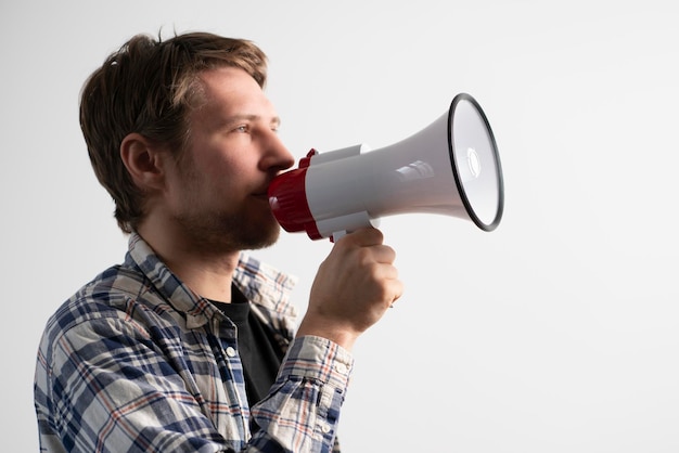 A young male screaming in the megaphone big announcement