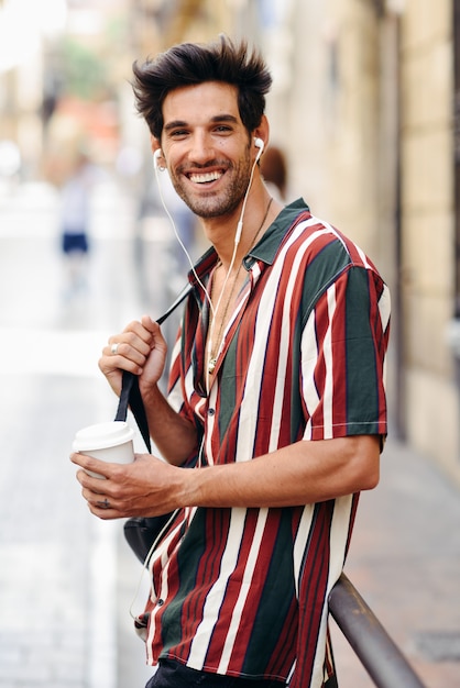 Young male traveler enjoying in the street 