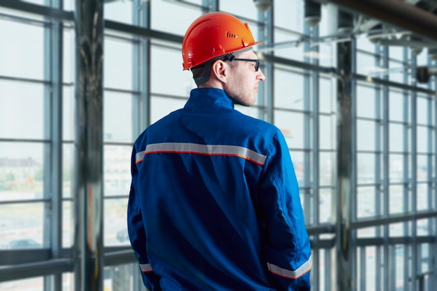 A young male worker portrait in the uniform