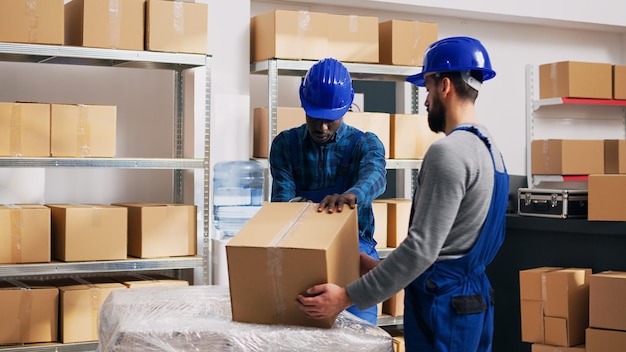 Young male workers checking merchandise in packages