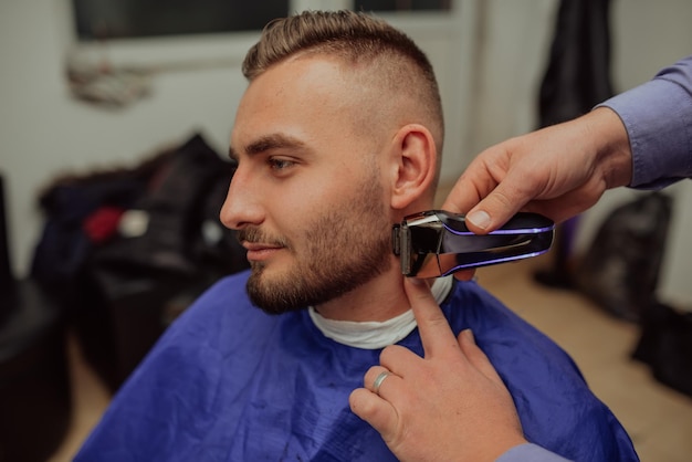 Young Man in Barbershop Hair Care Service Concept Selective focus High quality photo