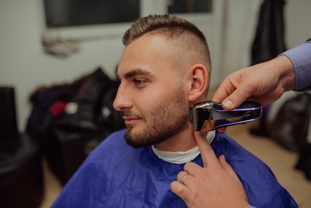 Young Man in Barbershop Hair Care Service Concept Selective focus High quality photo