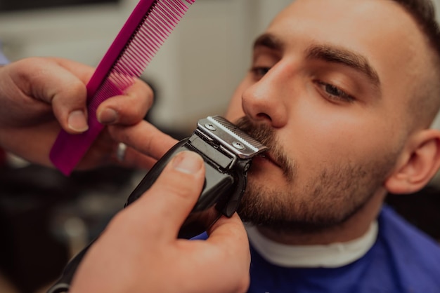 Young Man in Barbershop Hair Care Service Concept