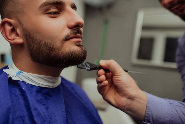 Young Man in Barbershop Hair Care Service Concept