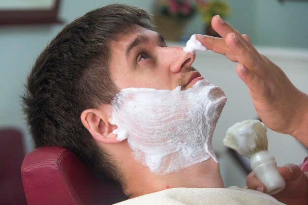 A young man in the barbershop