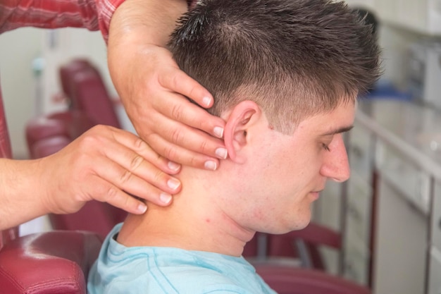 A young man in the barbershop