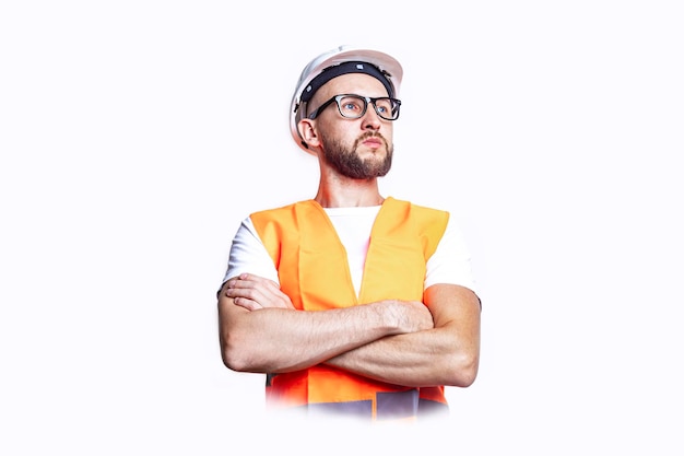 Young man in casual clothes, arms crossed on light background.