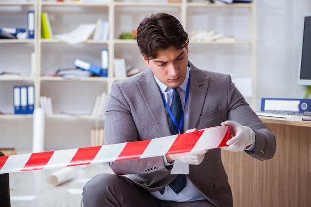 Young man during crime investigation in office