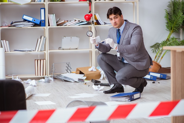 Young man during crime investigation in office