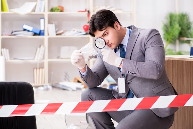 Young man during crime investigation in office