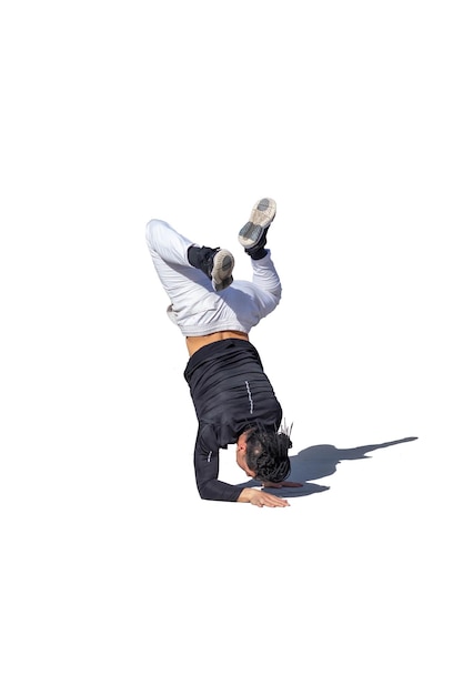 Young man doing break dance stunts with shade and white background