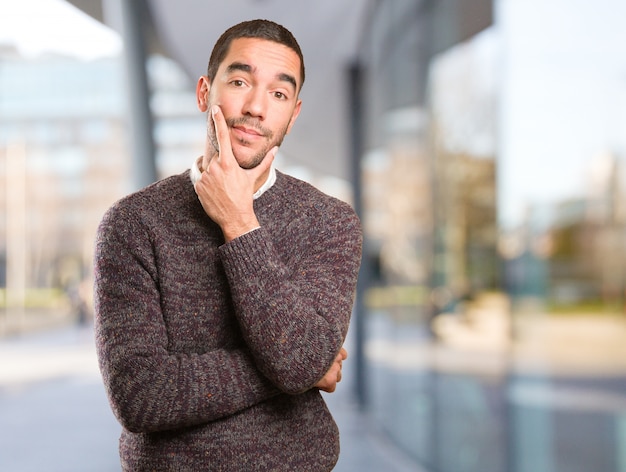 Young man doing a doubt gesture