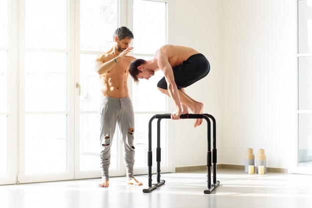 Young man doing a planche calisthenics exercise