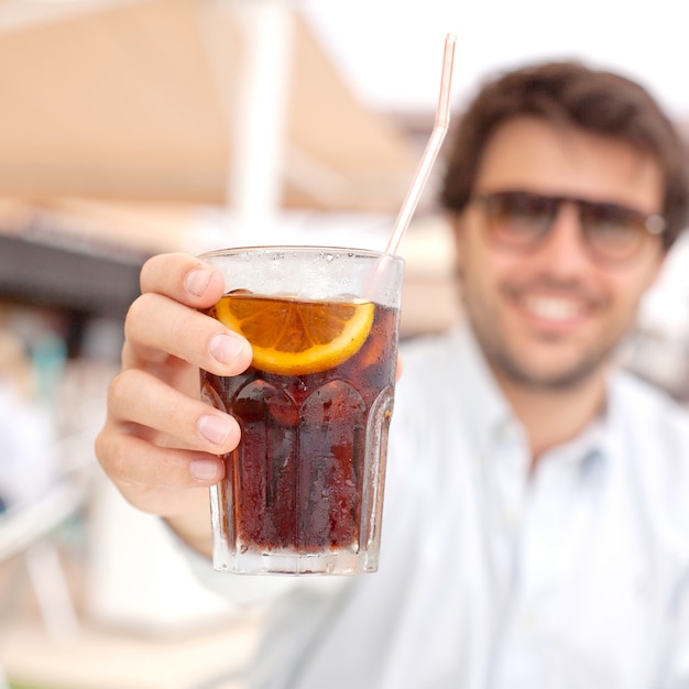 Young man drinking a beverage