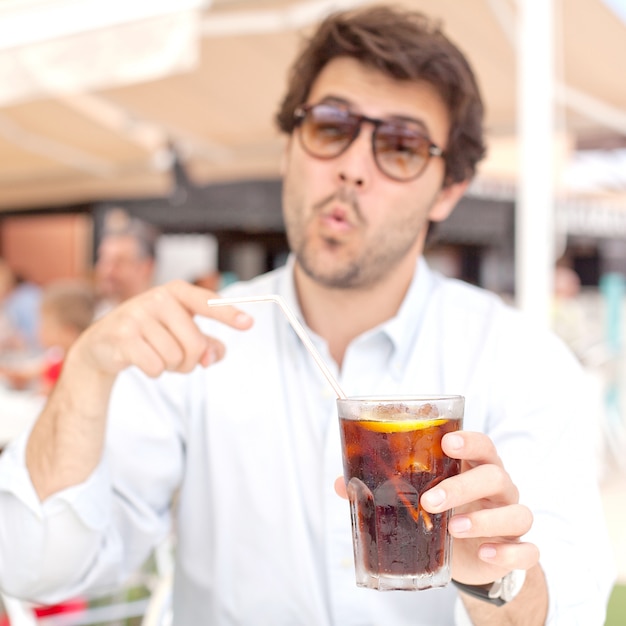 Young man drinking a beverage