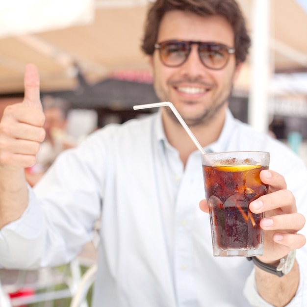 Young man drinking a beverage