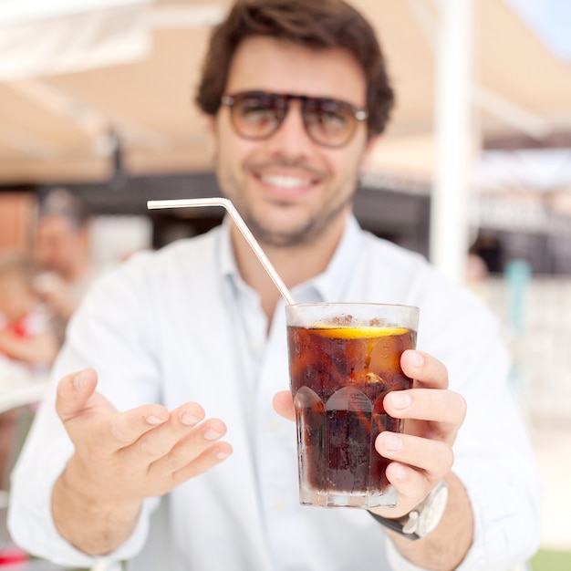 Young man drinking a beverage