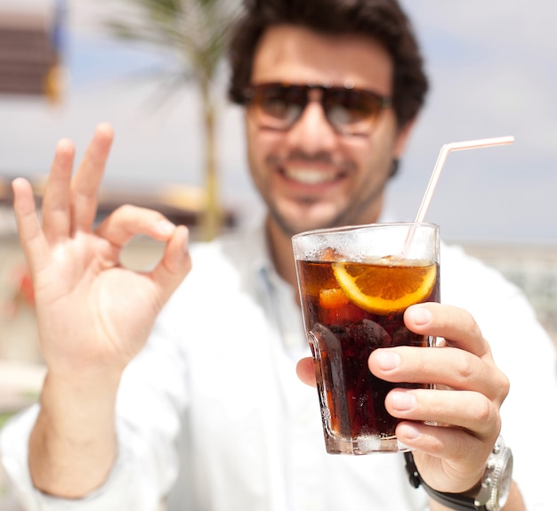 Young man drinking a beverage