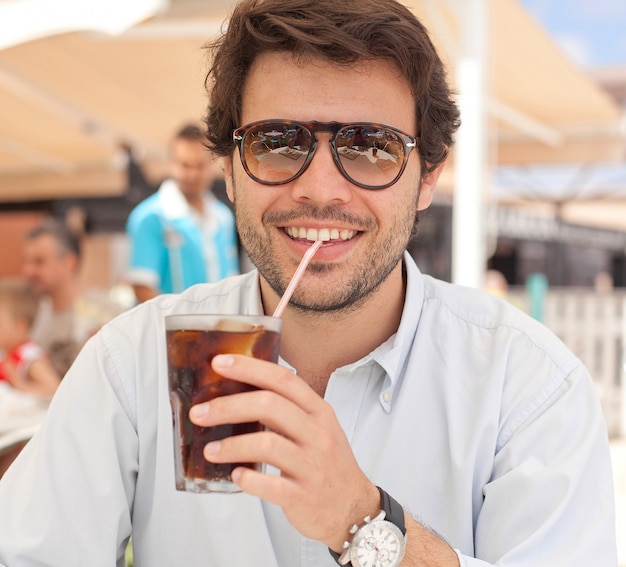 Young man drinking a beverage