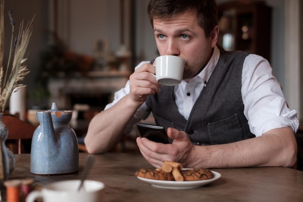 Young man drinking a coffee at the cafe