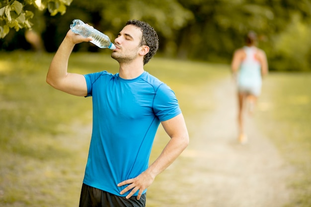 Young man drinking water