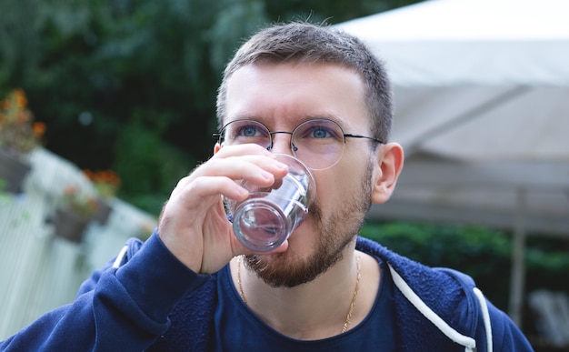 Young man drinks water Healthy lifestyle