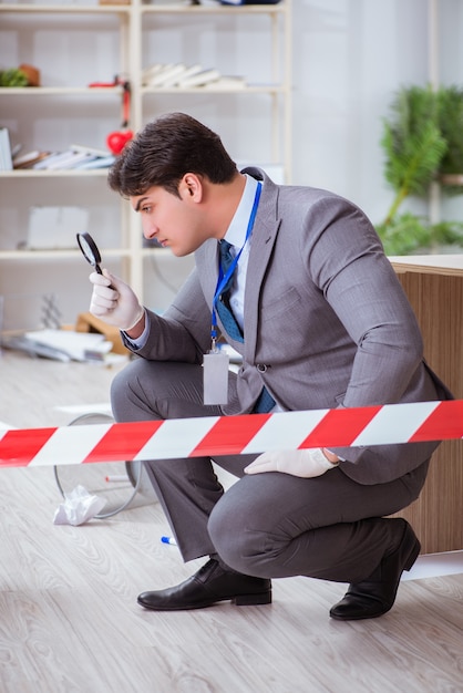 Photo young man during crime investigation in office