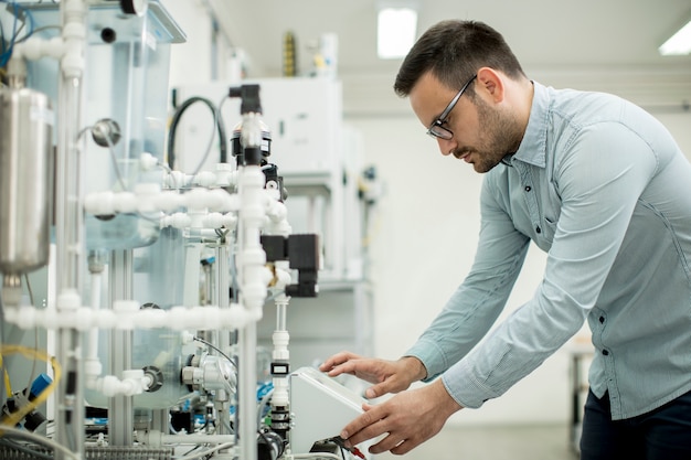 Young man in the electronic workshop