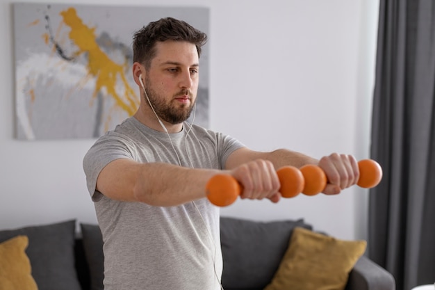 Young man exercising at home